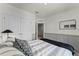 Bedroom featuring a neutral color scheme, modern black lamp, and closet with double doors at 3368 Private Oak Dr, Apopka, FL 32703