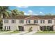 Charming two-story townhome with landscaped yard and attached garages at 3368 Private Oak Dr, Apopka, FL 32703