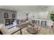 Spacious open-concept living area featuring dining and living areas with a modern kitchen at 3368 Private Oak Dr, Apopka, FL 32703