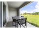 Covered patio featuring a modern dining table and outdoor views at 3368 Private Oak Dr, Apopka, FL 32703