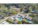 Aerial view of home showing fenced backyard, swimming pool, rear patio, garage and tree-lined street at 345 Overstreet Ave, Longwood, FL 32750