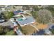 Aerial view of home showing fenced backyard, swimming pool and tree-lined street at 345 Overstreet Ave, Longwood, FL 32750