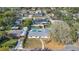 Aerial view of home showing fenced backyard, swimming pool and tree-lined street at 345 Overstreet Ave, Longwood, FL 32750