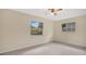 Inviting bedroom featuring carpet, natural light from the windows, and a ceiling fan at 345 Overstreet Ave, Longwood, FL 32750