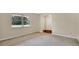 Bright bedroom with neutral carpet, large window, and closet at 345 Overstreet Ave, Longwood, FL 32750