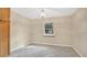 A well-lit dining room, featuring tile flooring and natural light from the window, adjacent to built-in cabinetry at 345 Overstreet Ave, Longwood, FL 32750