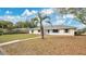 A well-maintained lawn and lovely landscaping surround this single story home at 345 Overstreet Ave, Longwood, FL 32750