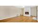 Spacious living room featuring a cozy fireplace and gleaming hardwood floors at 345 Overstreet Ave, Longwood, FL 32750