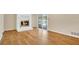Comfortable living space featuring a white brick fireplace and hardwood flooring at 345 Overstreet Ave, Longwood, FL 32750