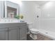 Modern bathroom featuring tile flooring, updated vanity, and glass enclosed shower at 38934 Merrell Ave, Umatilla, FL 32784