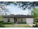 Charming single-story home featuring a well-maintained lawn and a classic architectural design at 38934 Merrell Ave, Umatilla, FL 32784