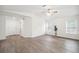 Bright living room with modern flooring, large windows, and plenty of natural light at 38934 Merrell Ave, Umatilla, FL 32784