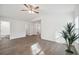 Bright living room features modern flooring and access to bathroom and closets at 38934 Merrell Ave, Umatilla, FL 32784