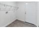 Mud room with wire rack shelving, access to the exterior, and wood-look vinyl flooring at 38934 Merrell Ave, Umatilla, FL 32784