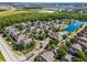 Aerial view of community with pool, lake, and well-manicured landscaping at 4008 San Gallo Dr # 102, Kissimmee, FL 34741