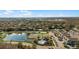 A beautiful aerial view of the community showing playground, pond, tennis court, and pool at 4008 San Gallo Dr # 102, Kissimmee, FL 34741