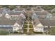 Aerial view showcasing colorful townhomes in a well-maintained community with mature landscaping at 4008 San Gallo Dr # 102, Kissimmee, FL 34741