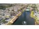 Stunning aerial view of colorful townhomes surrounding a picturesque lake with a fountain and community pool at 4008 San Gallo Dr # 102, Kissimmee, FL 34741