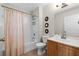 Bright bathroom features a shower-tub combination and neutral color palette at 4008 San Gallo Dr # 102, Kissimmee, FL 34741