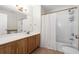 Well-lit bathroom with vanity sink, full mirror, shower-tub combination, and a standard toilet at 4008 San Gallo Dr # 102, Kissimmee, FL 34741