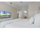 Relaxing bedroom with a large television and access to a bathroom and kitchen at 4008 San Gallo Dr # 102, Kissimmee, FL 34741
