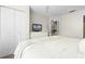 Bright bedroom with ceiling fan, closet, television, and a view to the en suite bathroom at 4008 San Gallo Dr # 102, Kissimmee, FL 34741