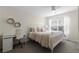Bright bedroom with decorative wall hangings, desk, ceiling fan and a large window at 4008 San Gallo Dr # 102, Kissimmee, FL 34741