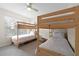 Bedroom features two sets of bunk beds with natural light from a nearby window at 4008 San Gallo Dr # 102, Kissimmee, FL 34741