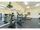 Well-equipped fitness center featuring treadmills, elliptical machines, and stationary bikes with mirrored walls at 4008 San Gallo Dr # 102, Kissimmee, FL 34741