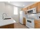 Clean and bright kitchen with tile flooring, white appliances, and a modern faucet at 4008 San Gallo Dr # 102, Kissimmee, FL 34741