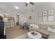 Inviting living room showcasing comfortable seating, neutral tones, and an adjacent kitchen with a breakfast bar at 4008 San Gallo Dr # 102, Kissimmee, FL 34741