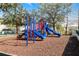 A colorful playground with slides and climbing structures, set on a wood chip base for safety and fun at 4008 San Gallo Dr # 102, Kissimmee, FL 34741