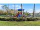 A fenced-in playground with play structures and safety surfacing, inviting families for outdoor play at 4008 San Gallo Dr # 102, Kissimmee, FL 34741