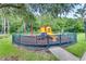 A fenced playground on woodchips, offering a safe play area with climbing and sliding activities at 4008 San Gallo Dr # 102, Kissimmee, FL 34741