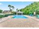 Community pool with lounge chairs, a gazebo, and a brick patio at 4008 San Gallo Dr # 102, Kissimmee, FL 34741