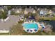 Community pool and playground surrounded by lush landscaping at 4008 San Gallo Dr # 102, Kissimmee, FL 34741