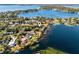 Aerial image showcasing a lakefront community surrounded by lush greenery and serene blue waters at 407 W 1St Ave, Windermere, FL 34786