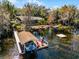 Expansive waterfront property featuring a private boat dock and serene water views at 407 W 1St Ave, Windermere, FL 34786