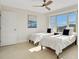 Comfortable bedroom featuring twin beds, tile flooring, and serene ocean view at 4651 S Atlantic Ave # 3060, Ponce Inlet, FL 32127