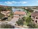 An aerial view of a beautiful two-story home, lake access, and lush landscaping in a well-maintained community at 4903 Eastlake Vista Dr, St Cloud, FL 34771