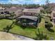 An expansive backyard with an enclosed pool, lush grass, and verdant landscaping perfect for outdoor activities at 4903 Eastlake Vista Dr, St Cloud, FL 34771