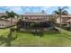 A screened pool and spa are surrounded by a meticulously kept lawn, making this backyard ideal for relaxation at 4903 Eastlake Vista Dr, St Cloud, FL 34771