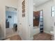 Bright bathroom with tiled shower and adjacent bedroom view at 4903 Eastlake Vista Dr, St Cloud, FL 34771