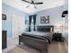 Inviting bedroom featuring natural light, soft blue walls, and double closets at 4903 Eastlake Vista Dr, St Cloud, FL 34771