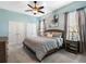 Spacious bedroom with ceiling fan, windows, and walk-in closets at 4903 Eastlake Vista Dr, St Cloud, FL 34771