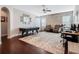Large bonus room with air hockey table, hardwood floors, and accent brick wall at 4903 Eastlake Vista Dr, St Cloud, FL 34771