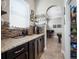 Coffee bar area featuring granite countertops, custom cabinetry, backsplash, and a coffee machine at 4903 Eastlake Vista Dr, St Cloud, FL 34771