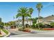 Inviting entrance to East Lake Park featuring beautiful landscaping, brick accents, and a secure gated entry at 4903 Eastlake Vista Dr, St Cloud, FL 34771