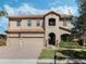 Charming two-story home with three-car garage, tile roof and manicured lawn at 4903 Eastlake Vista Dr, St Cloud, FL 34771
