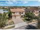 Stunning two-story home featuring a red tile roof, a two-car garage, and beautifully landscaped grounds at 4903 Eastlake Vista Dr, St Cloud, FL 34771